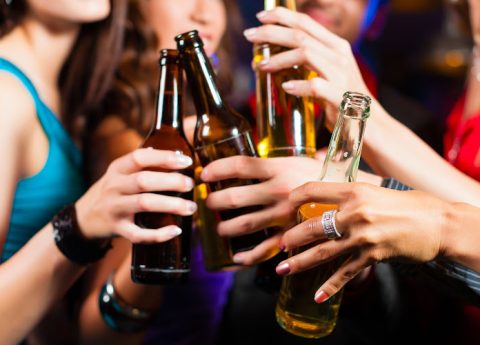 25905370 - group of party people - men and women - drinking beer in a pub or bar